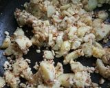 A picture of step 4 of Potato 's dry veg.