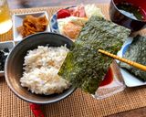 A picture of step 2 of Japanese Breakfast (how to eat Nori seaweed and rice).