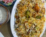A picture of step 8 of Chicken malai biryani.