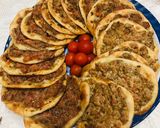 A picture of step 5 of Sfiha with Tomato and Tahini.