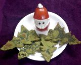 A picture of step 3 of Tomato santa with spinach Christmas trees.