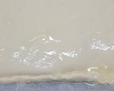 Foto del paso 10 de la receta: 179. Coca de San Juan de hojaldre, crema y piñones
