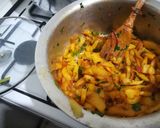 A picture of step 8 of Orange flavoured chips masala.