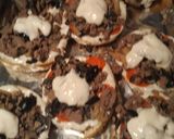 A picture of step 6 of Bagel Alfredo Sauce Pizza.