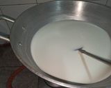 A picture of step 9 of Dodha Burfi with Daliya.