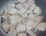 A picture of step 1 of Boiled Nduma (arrowroot) with Cardamon and Onion.
