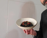 Foto del paso 9 de la receta: Arroz negro meloso con sepia y pimientos del piquillo