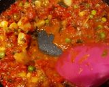 A picture of step 5 of Shakshuka (In my style- Poached eggs in tomato and veggie gravy).