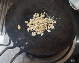 A picture of step 1 of Praline Cashew Chocolate Cluster.