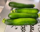 A picture of step 1 of Zucchini and Tomatoes with Bacon and Cilantro.