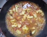 A picture of step 7 of Muri ghonto/Bengali fish head with rice.