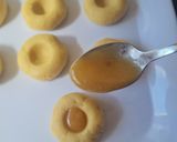 A picture of step 9 of Jam Thumbprint Cookies.