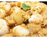 A picture of step 5 of Egg curry with bell peppers.