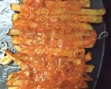 A picture of step 2 of French fries pizza.