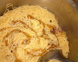 A picture of step 2 of Stir fried pasta with smoked fish.