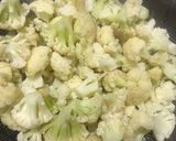 A picture of step 2 of Gobhi Matar masala.
