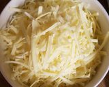 A picture of step 4 of Cheese and broccoli baked potatoes.