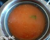 A picture of step 3 of Orange Tomato Cocktail.