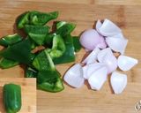 A picture of step 1 of Soya Chunks Capsicum & Onion Curry soyabeena badi ki sabji.