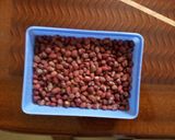 A picture of step 4 of Roasted ground nuts in a salted pan.