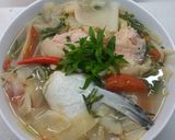 Hình bước làm 4 của món Canh măng chua nấu đầu cá hồi