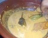 A picture of step 6 of Brinjal Curry in white gravy.