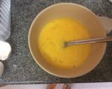 A picture of step 1 of Super Cheesy Scrambled Eggs.