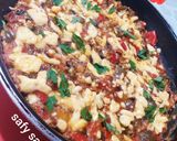 A picture of step 7 of Shakshuka with Eggs and Cheese.