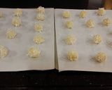 A picture of step 8 of Toasted Coconut Thumbprint Cookies.
