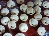 Agnelotis de acelga y ricota, con salsa