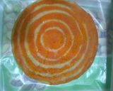 A picture of step 9 of Orange Marble Swiss Roll.