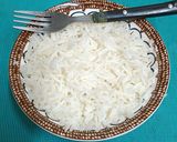 A picture of step 4 of A bowl Of Steaming Hot Basmati Rice In A Pressure Cooker.