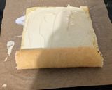 A picture of step 7 of Lemon curd Swiss roll.