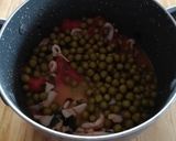 Foto del passaggio 4 della ricetta Calamari in umido con piselli e bruschette di pane