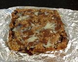 A picture of step 13 of Fresh Berrie Crumble Bars with White and Milk Chocolate Glaze.