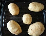 A picture of step 2 of Jacket Potatoes.