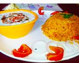 A picture of step 3 of Tomato Rice with boondi Raita.
