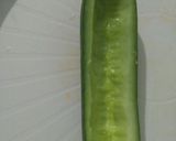 A picture of step 1 of Pickled cucumber & carrot accompanied with freshgreen & red chillies.