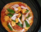 A picture of step 7 of Paneer Naan Pizza.