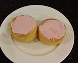A picture of step 15 of Vanilla Butter Cakes filled and Frosted with Whipped White Chocolate Rasberry Ganache.