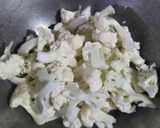 A picture of step 1 of Gobhi with raw turmeric.