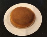 A picture of step 8 of Vanilla Layer Cake filled withLenon and Rasberry and frosted with Fresh Lemon Cream.