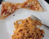 A picture of step 10 of Chicken fettuccine creamy pink pasta.