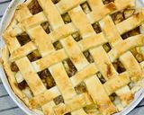 A picture of step 11 of Apple pie with flaky butter crust served with vanilla ice cream.