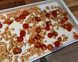 A picture of step 2 of Halloumi with pesto, balsamic tomatoes, spinach and chickpeas.