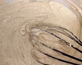 A picture of step 4 of Akara with beans powder.