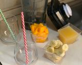 A picture of step 1 of Orange Mango Smoothie 🍊🍹.