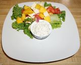 A picture of step 4 of Beer-Battered Fried Shrimp with Mango and Goat Cheese Salad.