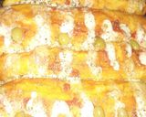 Foto del paso 4 de la receta: Enrollado a la pizza relleno con jamón, queso y tomate