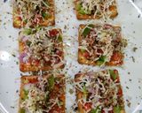A picture of step 3 of Cream cracker pizza bites.